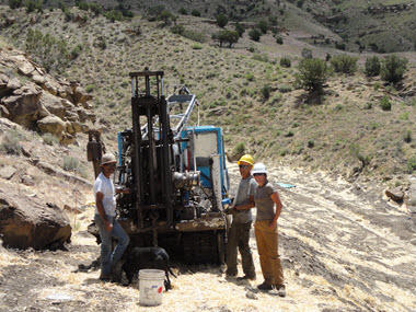 Photo of drill rig and rig operators