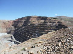 Photo of Cresson Mine highwall face showing benches and total depth.